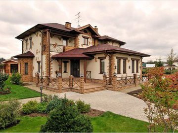 Декоративная отделка фасада загородного дома